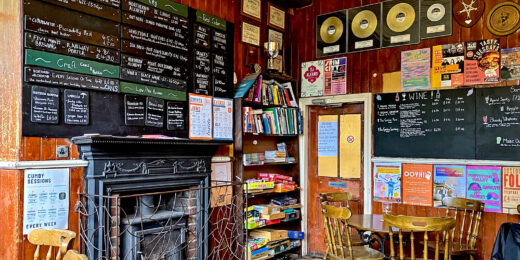 Cumberland Arms, Newcastle: Left room with fireplace & bookshelves