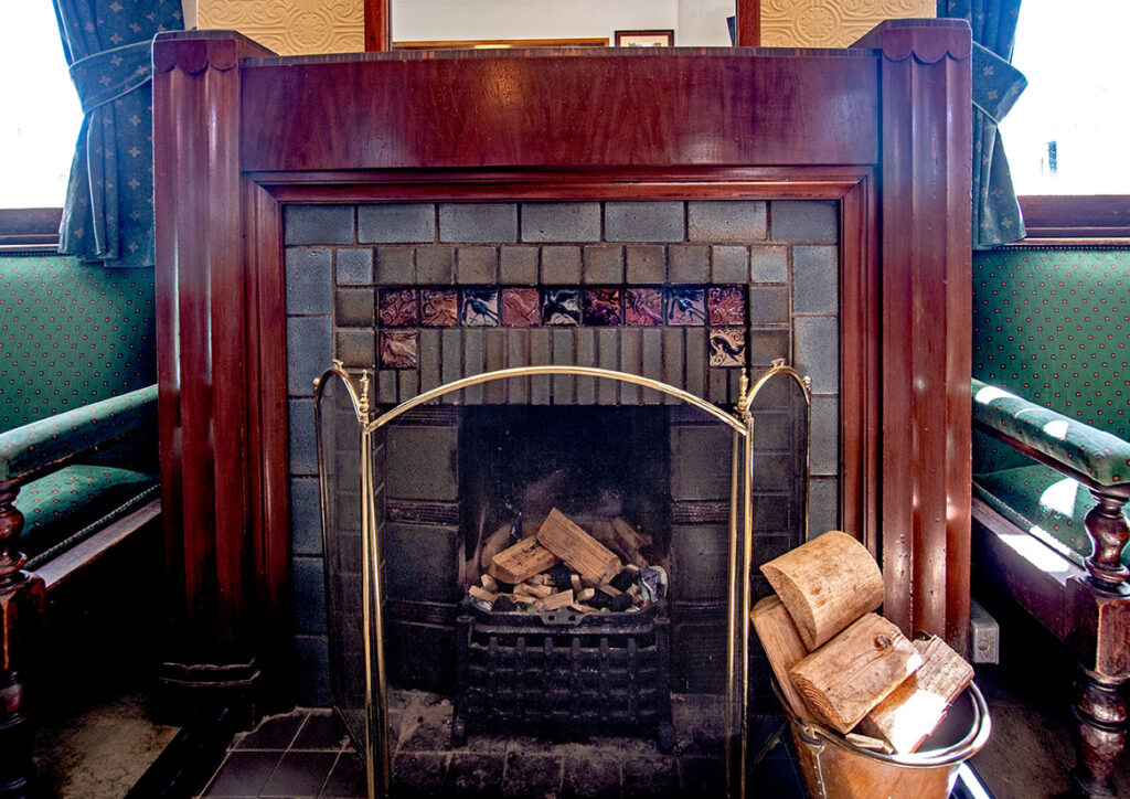Three Pigeons, Halifax: Wood & tile fireplace