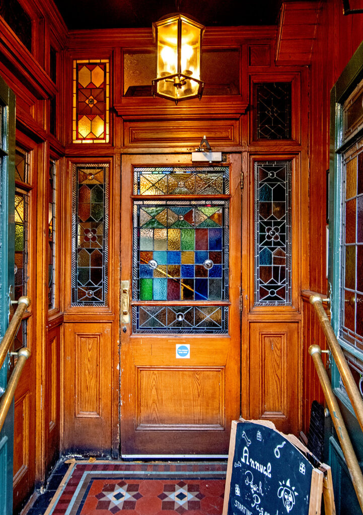 Warwick Castle, Maida Vale: Doorway with stained glass
