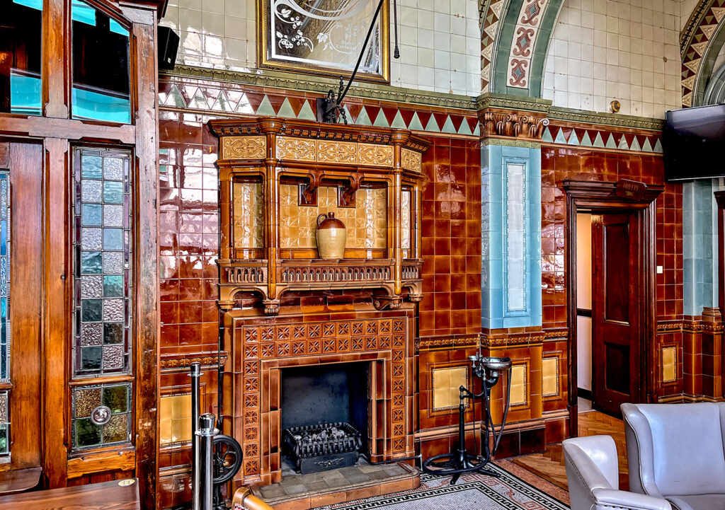 Dr Duncans, Liverpool: Close-up of tiled fireplace