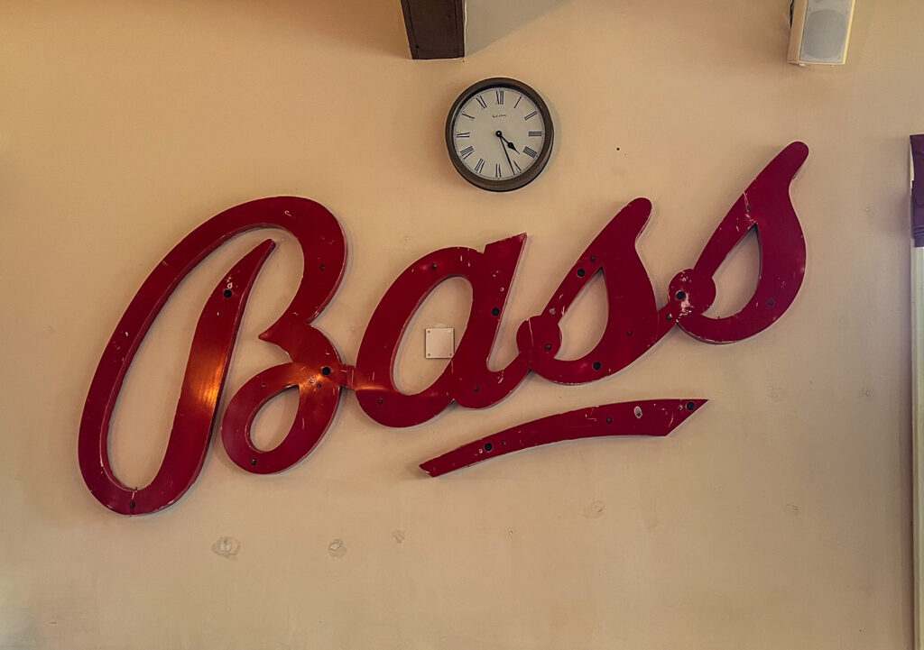 Smithfield, Derby: Large red Bass sign on an interior wall