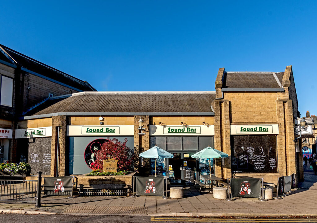 Sound Bar, Skipton: Exterior in daylight, single storey stone building with Sound Bar signs