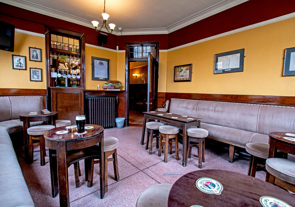 Swan, York: Public Bar with upholstered lilac bench seating