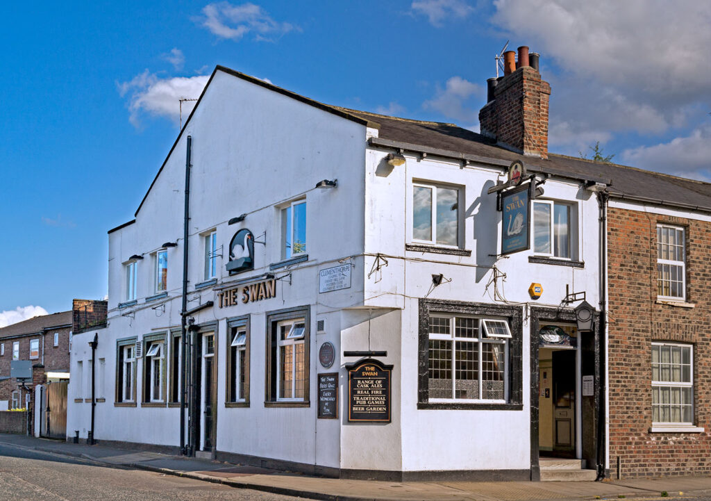 Swan, York: Exterior, a white painted end terrace pub