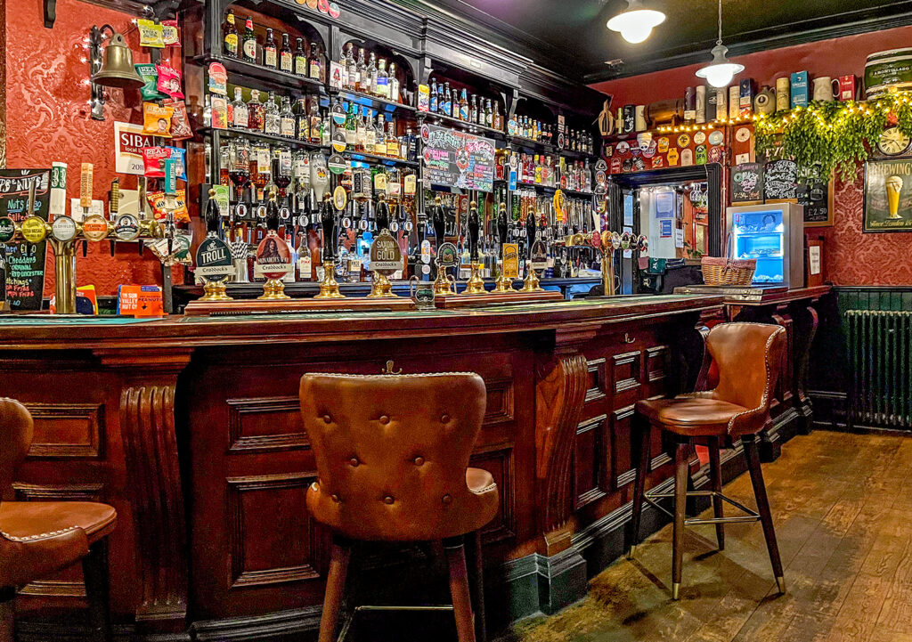 Duke William, Stourbridge: Main bar with carved wooden bar counter