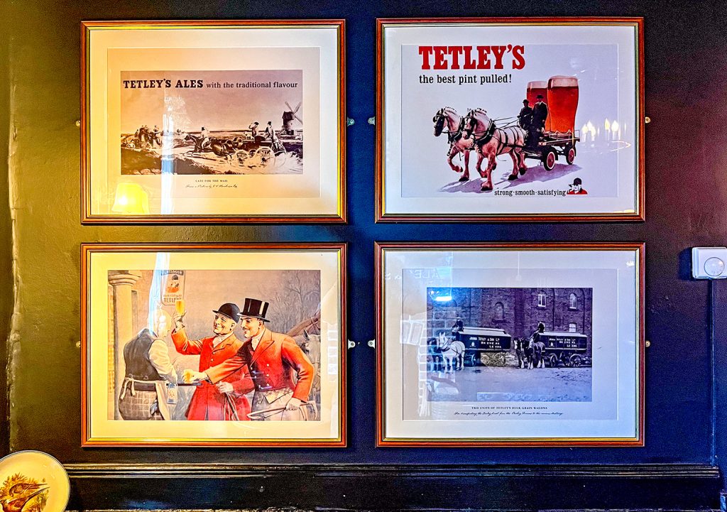 Highland Laddie, Leeds: Framed prints of Tetley brewery adverts and old photo.