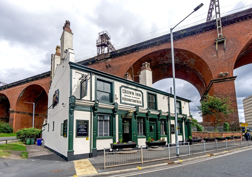 Crown, Stockport: Close-up of exterior with viaduct behind
