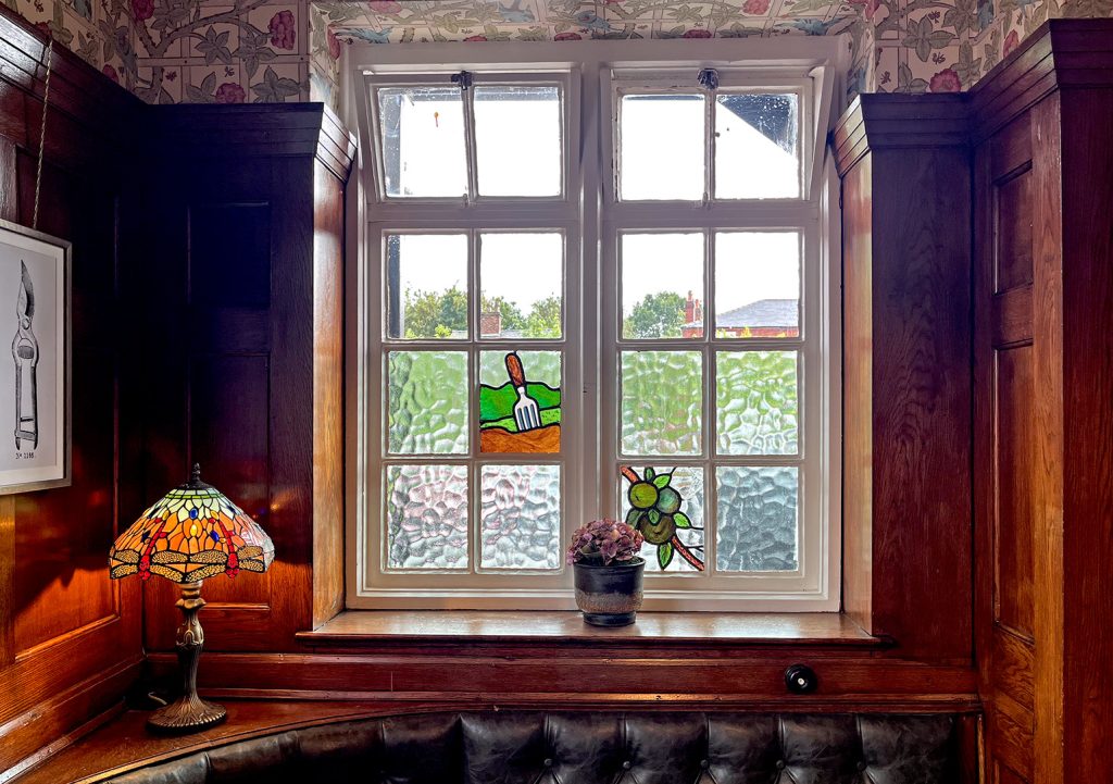 Nursery Inn, Stockport: Corner window with stained glass panels