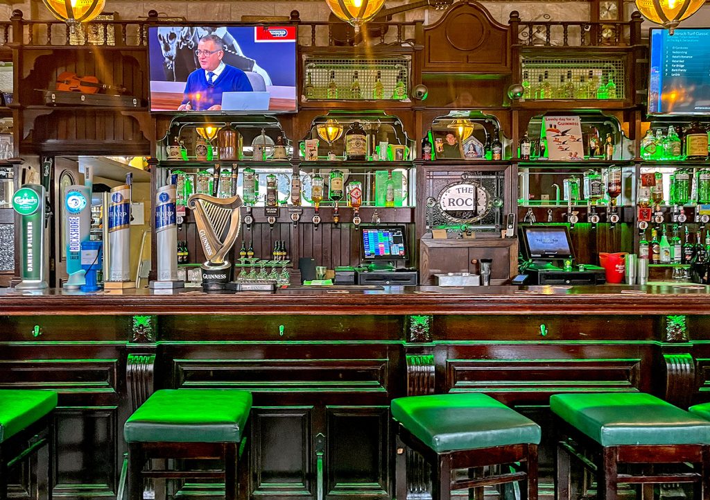 Rock, Belfast: Bar counter and bar back with stools and TVs