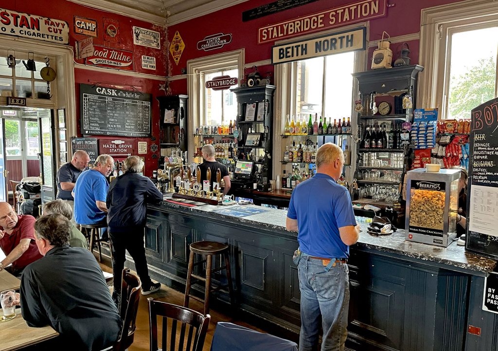 Station Buffet, Stalybridge: Main bar with customers, bar counter with marble top and railway signs on upper wall