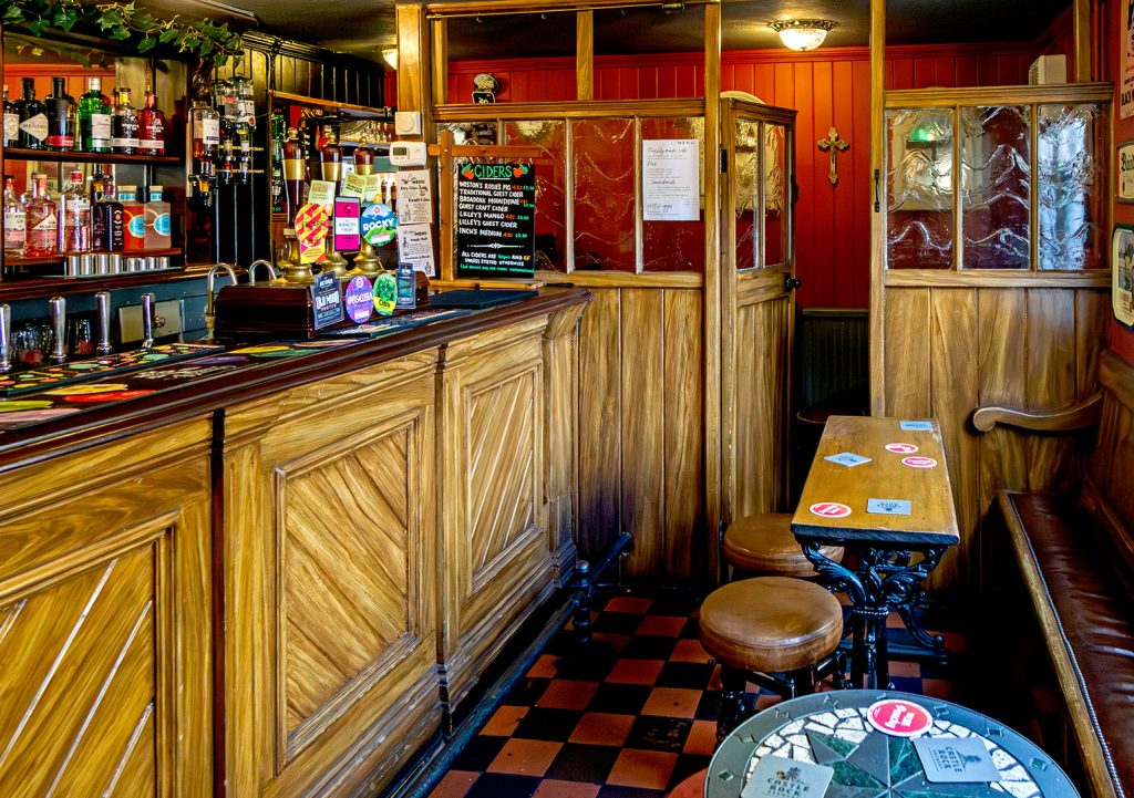 Small public bar with single bench and even smaller snug at the end