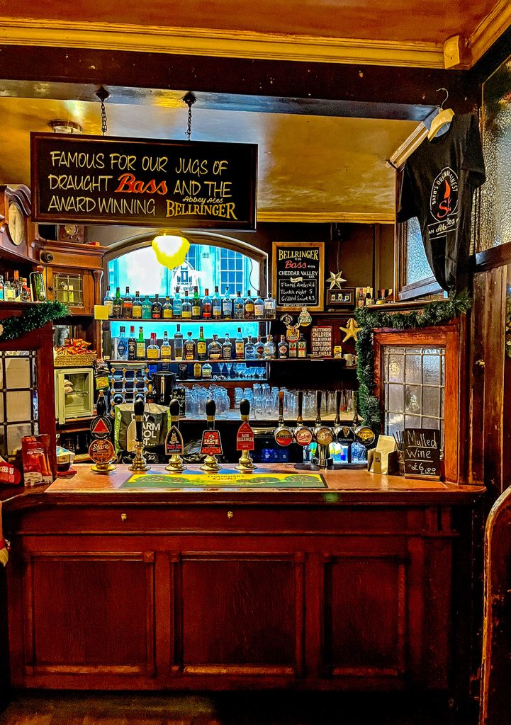 The public bar of theStar, Bath showing the bar counter with hand-pumps and a sign promoting the jugs of draught Bass