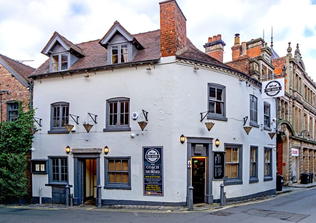 Coach & Horses, Shrewsbury: Exterior (2025), grey-white walls with dark grey windows and doors