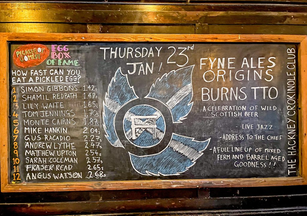 Cock, Hackney: Blackboard with pickled egg eating competition and ad for Burns night event