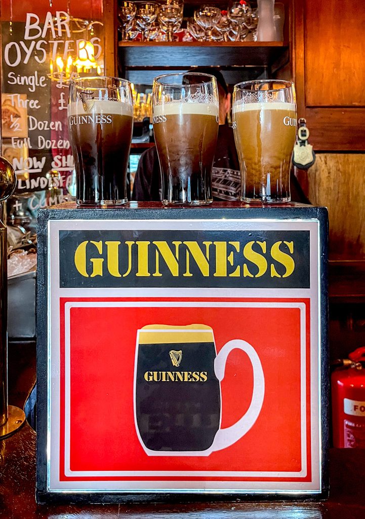 Highland Laddie, Leeds: Three pints of Guinness standing on top of vintage Guinness tap.