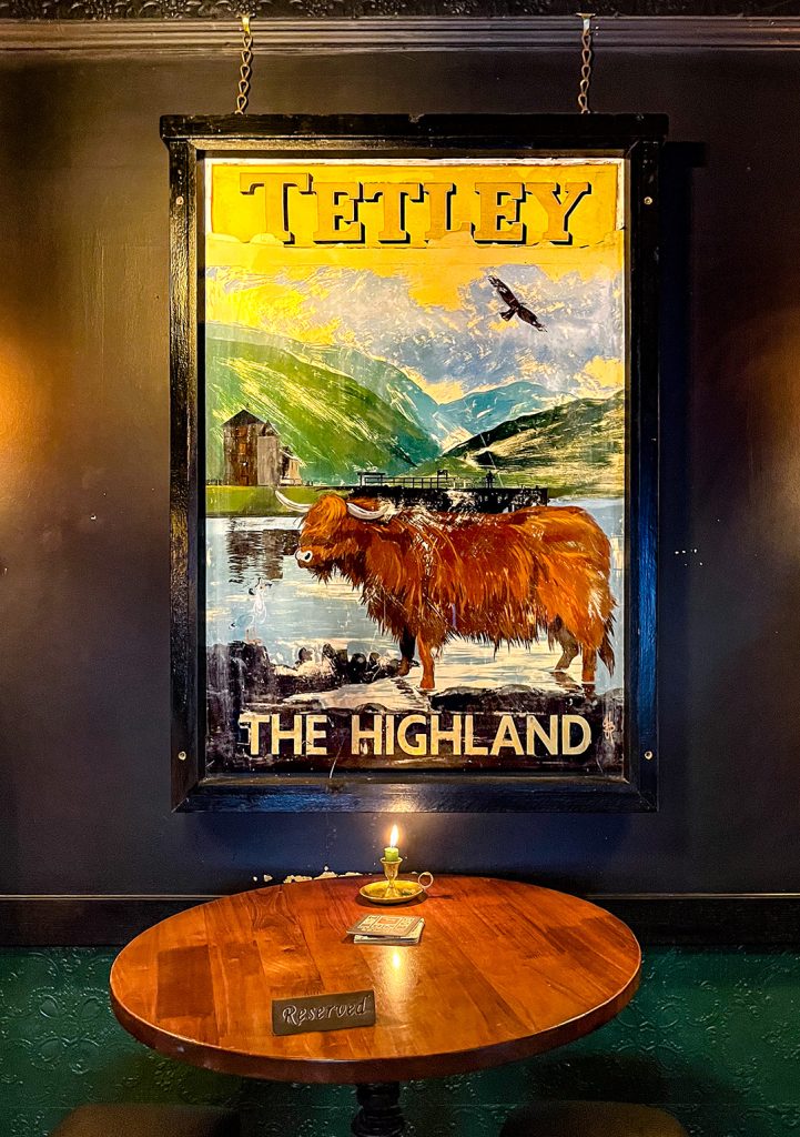 Highland Laddie, Leeds: Old Tetley inn sign on wall inside the pub.