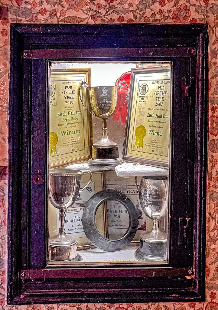 Birch Hall, Beck Hole: Display window in the Big Bar with awards won by the pub.